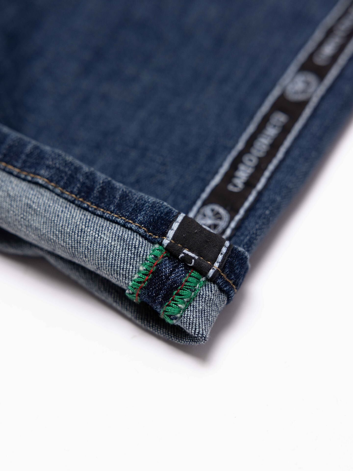 Destroyed jeans with side piping